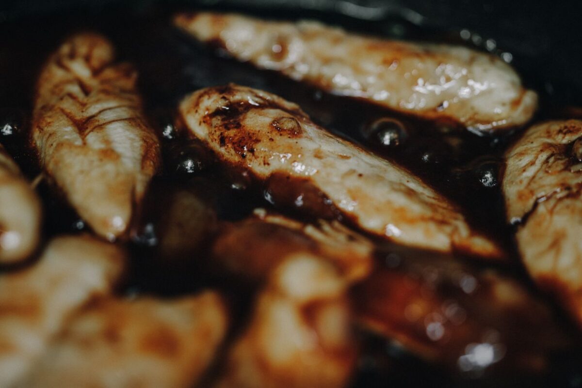 The Forgotten Pantry Ingredient That Makes Pork Chops Taste Richer and Sweeter 3 close-up-of-sizzling-marinated-chicken-in-pan-